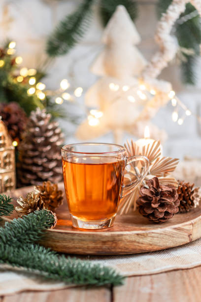 istock Cup of tea in cozy kitchen with Christmas decorations 1837604174