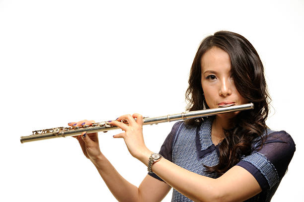 istock Beautiful Asian woman playing flute 183760457