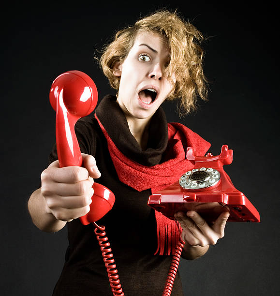 istock Young Woman shouting into telephone 183760475