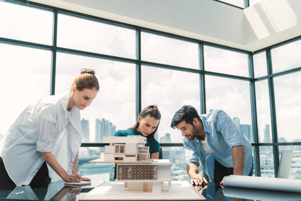 istock Professional architect team working together to design house model. Tracery. 1837605236