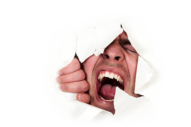 uomo intrappolato dietro carta bianca parete - human mouth paper screaming hole foto e immagini stock