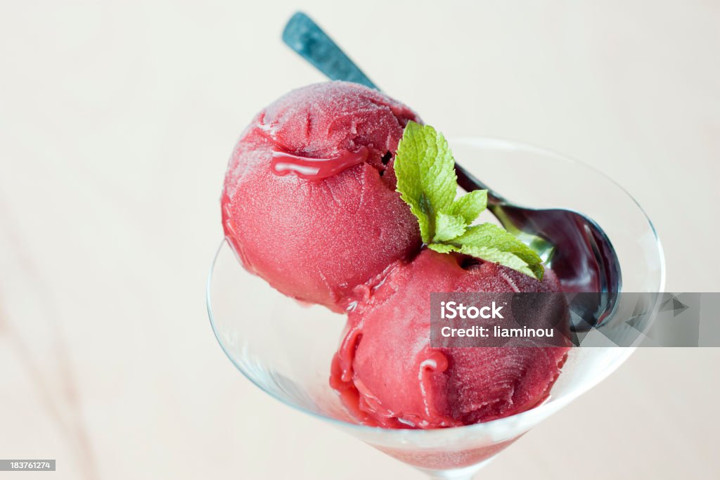 strawberry sorbet delicious strawberry sorbet in martini glass decorated with mint leaves ice cream Strawberry Sorbet Stock Photo