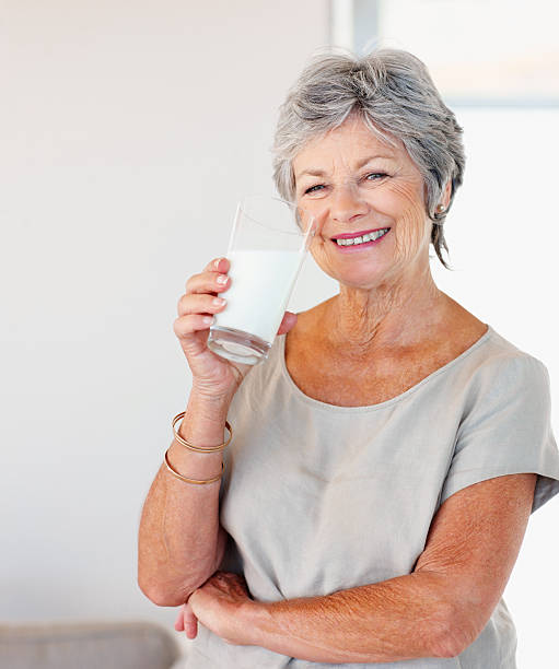 istock Senior woman drinking milk 183761322