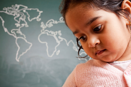 Cute Little Indian Preschool Girl in Front of World Map