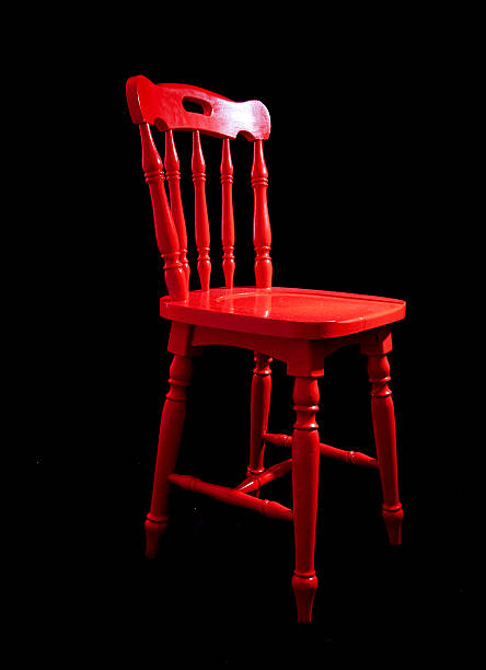 old beach chair sits quietly with peeling paint