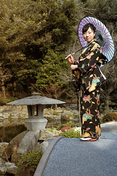 istock Woman in kimono with umbrella on the bridge 183762110