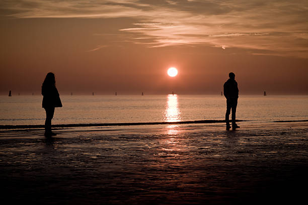 istock Lovers on the beach at sunset 183762177