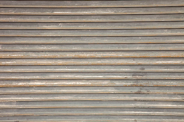 istock Bare metal security door background, rust and silver colors 183762819