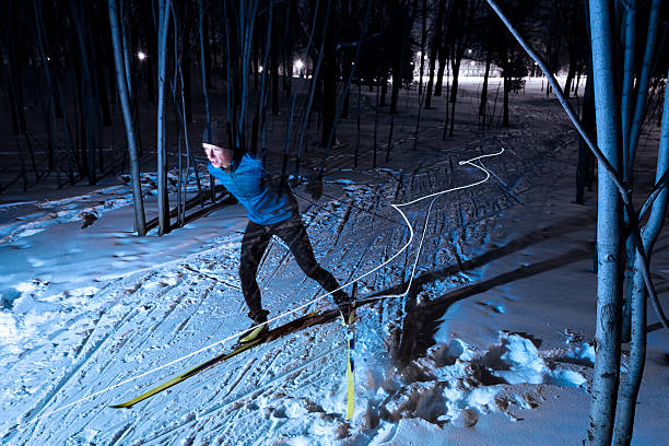 Cross-country skier at night stock photo