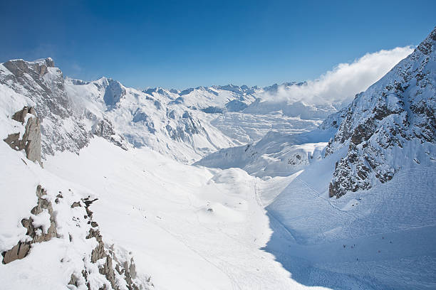 Sunny winter day in skiing area in the Paznaun valley. Location place famous ski resort Silvretta Arena Ischgl/Samnaun on the Swiss Austrian border. State Tyrol, Europe. Discover the beauty of earth.