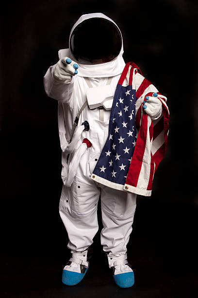 istock Astronaut holding an American Flag 183763371