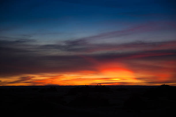 istock Sunset with red glow over Libyan Sahara desert 183763911