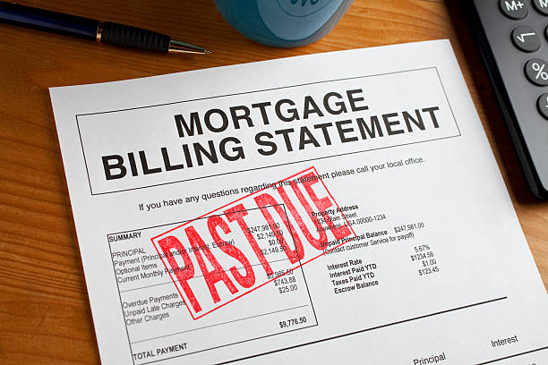 Past Due Mortgage statement on a desk. Past Due Rubber Stamped onto a mortgage document foreclosure photos stock pictures, royalty-free photos & images