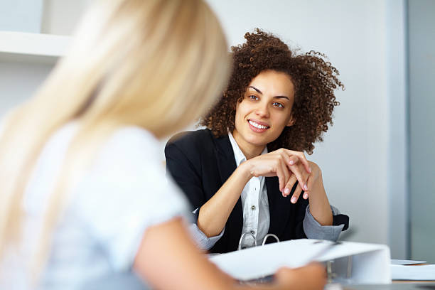 istock Business women discussing 183764431