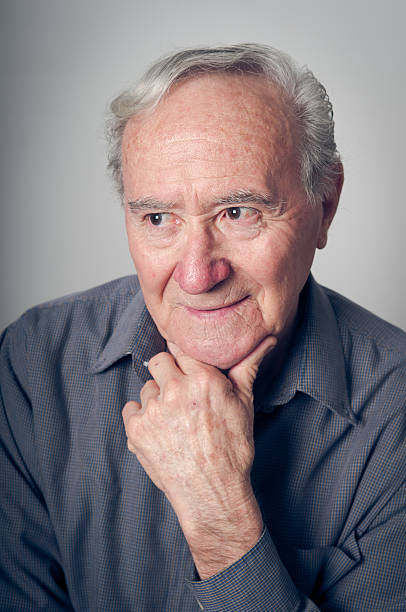 istock pensive and peaceful senior man in a relaxed mood 183764478