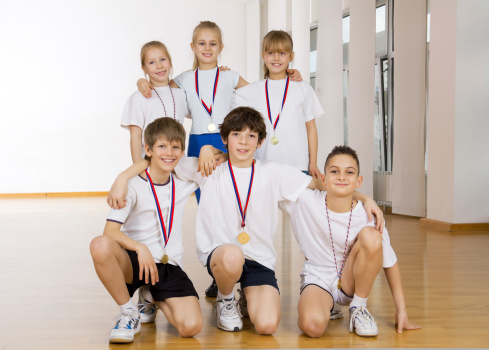 Group of happy children with medals.