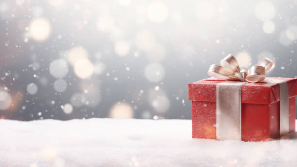 istock Red Gift Box in Snow with Bokeh Background 1837652994
