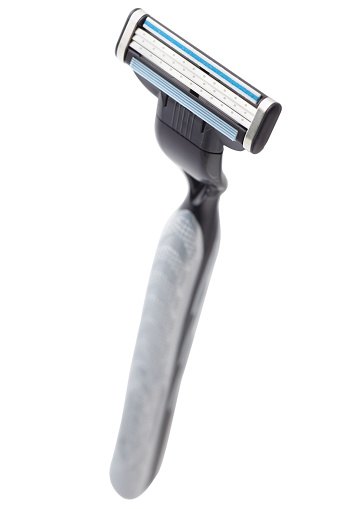 Disposable shaving razor on white background