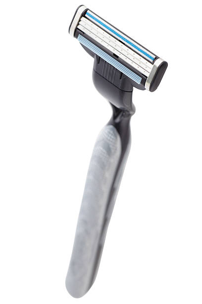 Black razor on white background Disposable shaving razor on white background razor blade stock pictures, royalty-free photos & images