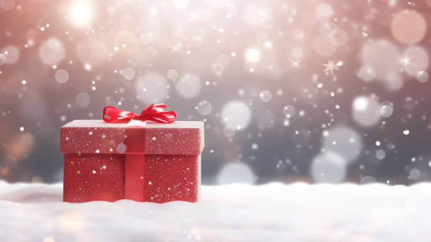 istock Red Gift Box in Snow with Bokeh Background 1837655131