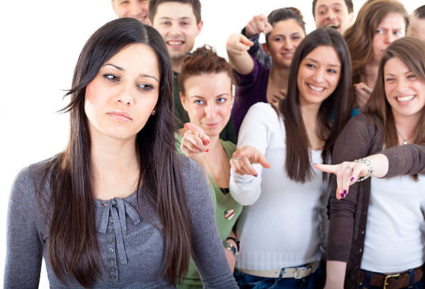 istock Crowd pointing fingers at a young woman 183765661