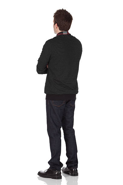 istock Rear view of a man standing with arms crossed 183766708
