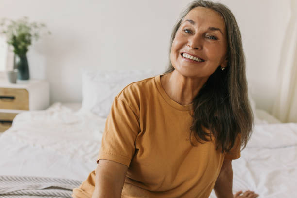 istock Charming elderly Caucasian woman looking at camera with cheerful face expression and lovely wide smile showing her healthy white teeth. Aging gracefully, human appearance, lifestyle 1837672584
