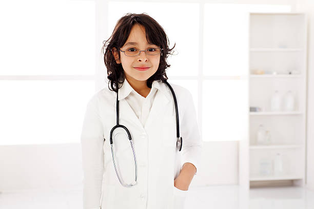 istock Boy doctor looking at the camera on workplace. 183767538