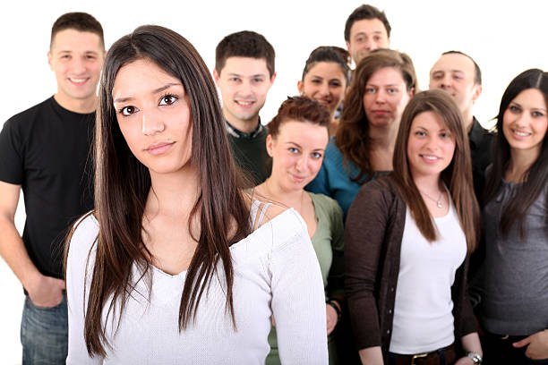istock Woman in front of a smiling crowd 183767921