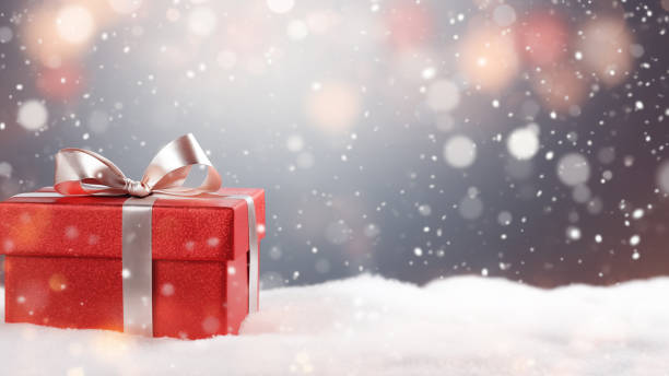 istock Sparkling Red Gift Box in Snowy Scene 1837681296