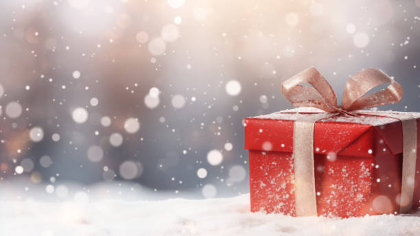 istock Sparkling Red Gift Box in Snowy Scene 1837683387