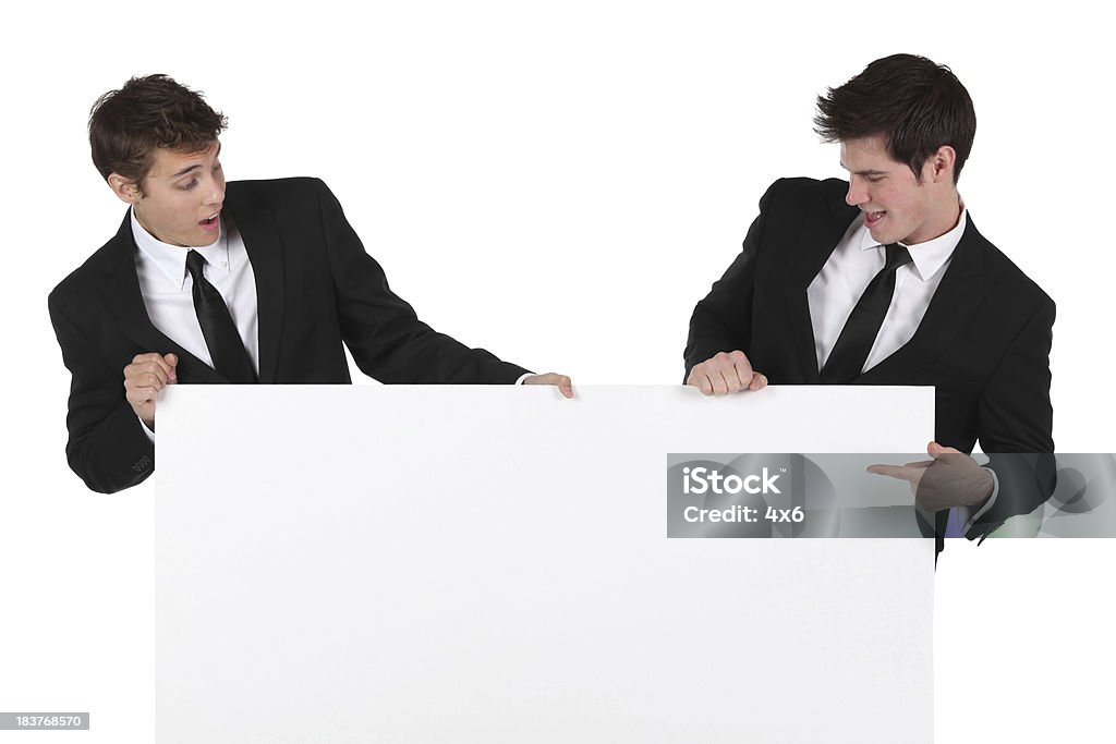 Zwei Geschäftsleute mit einem Transparent - Lizenzfrei Mit dem Finger zeigen Stock-Foto