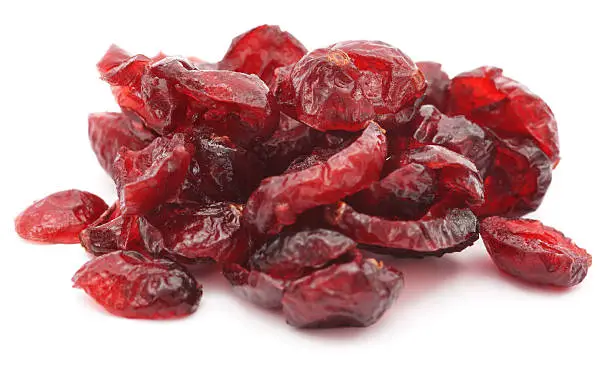 Dry cranberries pile on white background