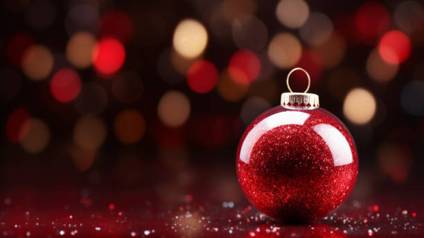 istock Sparkling Red Christmas Bauble on Bokeh Background 1837687239