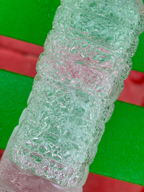 istock Closeup of plastic water bottle on a bench with condensation 1837687244