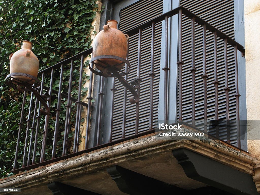 Spanish Balcony Jugs Spanish style balcony displaying two clay jugs. Antique Stock Photo