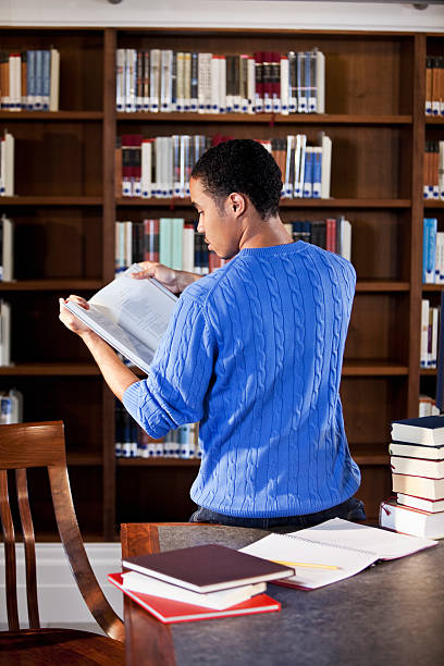 istock African American teenager studying in library 183769311