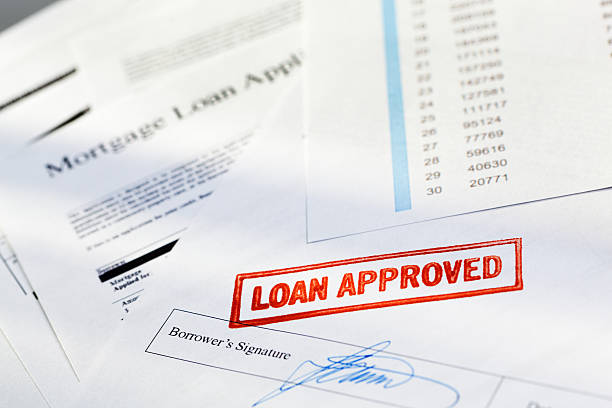 istock Mortgage Application Document with “Loan Approved” Red Approval Rubber Stamp 183769361