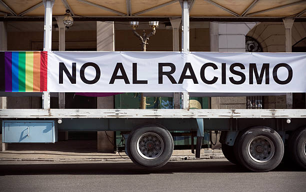 No racism "No Racism banner placed on a truck. Gay pride march in Buenos Aires, Argentina 2010." apartheid sign stock pictures, royalty-free photos & images