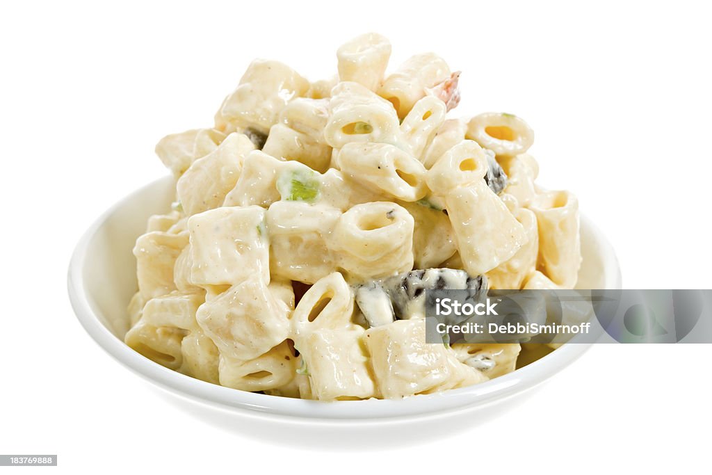 Macaroni Salad A white bowl full of macaroni salad. Macaroni Stock Photo