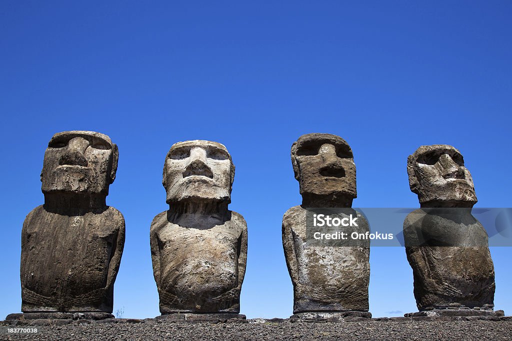 Ahu Tongariki Moais on Easter Island, Chile Ahu Tongariki Moais statues on Easter Island in Chile on a sunny day with blue sky.  Ancient Stock Photo