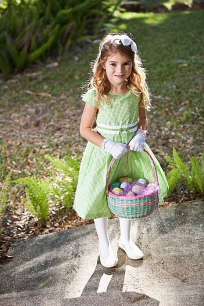 istock Pretty little girl holding easter egg basket 183770043
