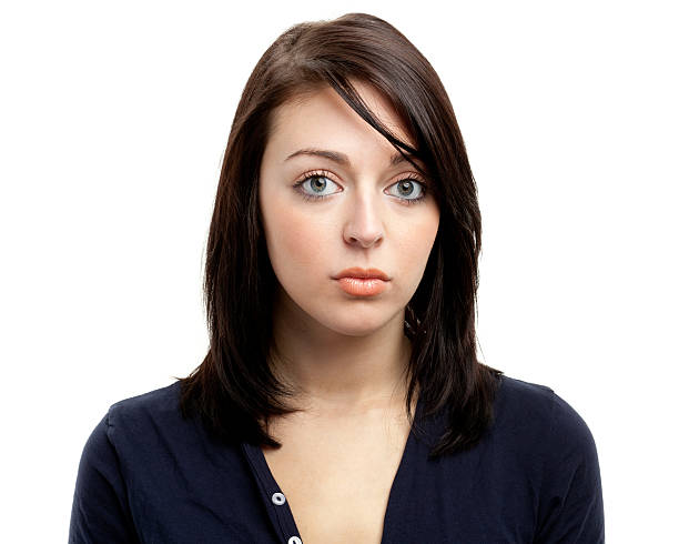 istock Young brunette female stares blankly into the camera lens 183770368