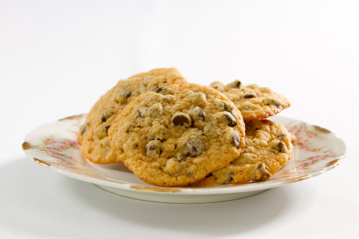 A plate of freshly baked chocolate chip cookies.