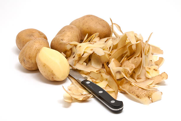 peeling potatoes close-up of peeled potatoes peeling food stock pictures, royalty-free photos & images