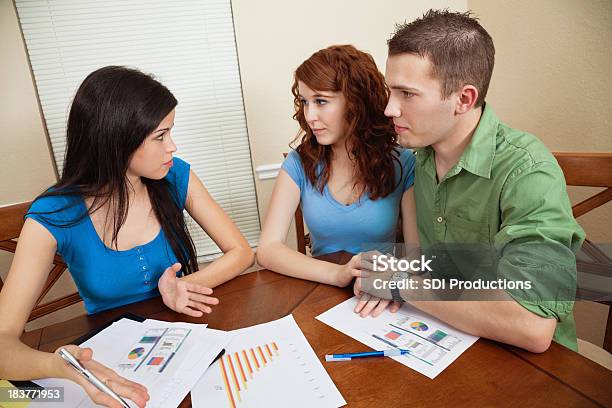 Financial Counselor Explaining Situation To Concerned Young Couple Stock Photo - Download Image Now