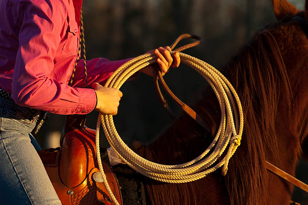 rodeo roper cow-girl - travel buckle part of on top of photos et images de collection