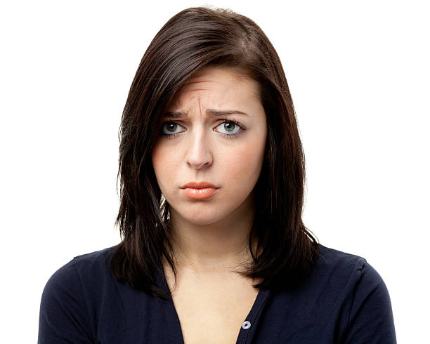 Sad Frowning Young Woman Looking At Camera
