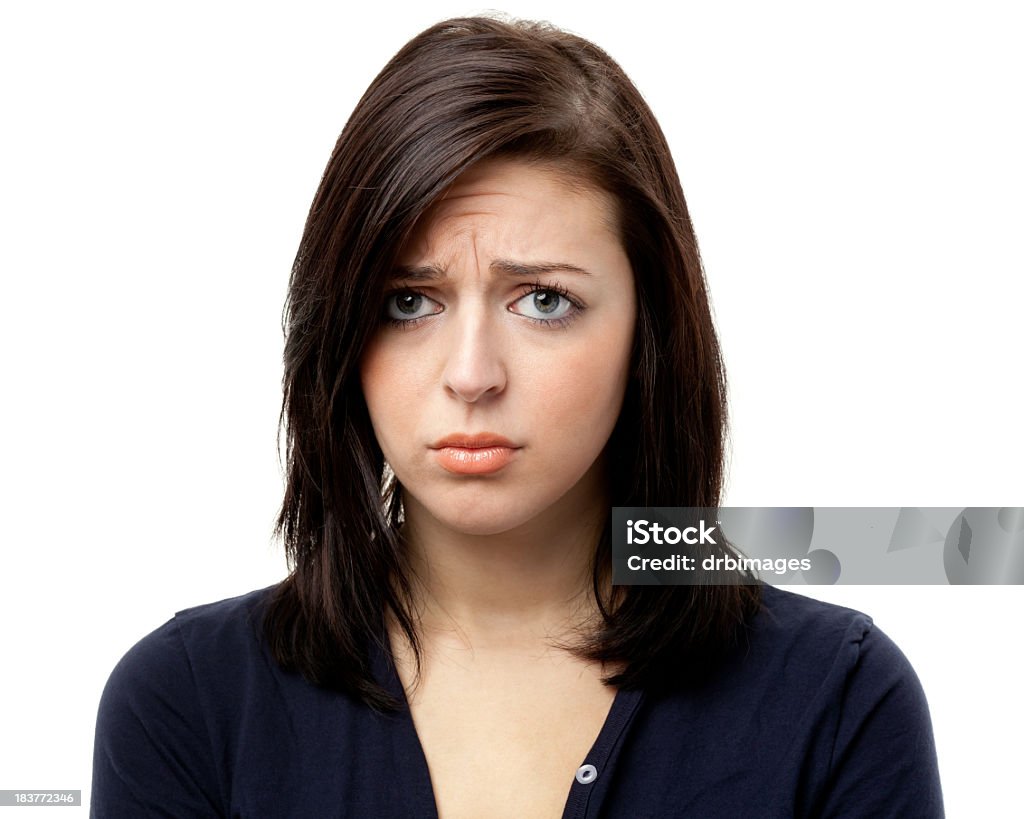 Sad Frowning Young Woman Looking At Camera Portrait of a woman on a white background. http://s3.amazonaws.com/drbimages/m/marbra.jpg Women Stock Photo