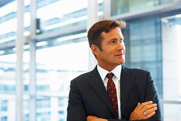 istock Business man standing with arms folded 183772428